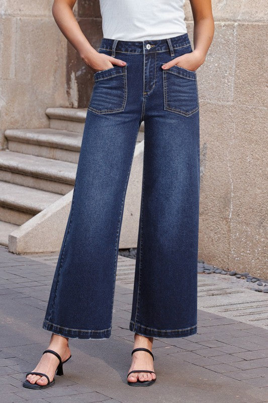 High-waist dark blue straight-leg jeans with front patch pockets and belt loops