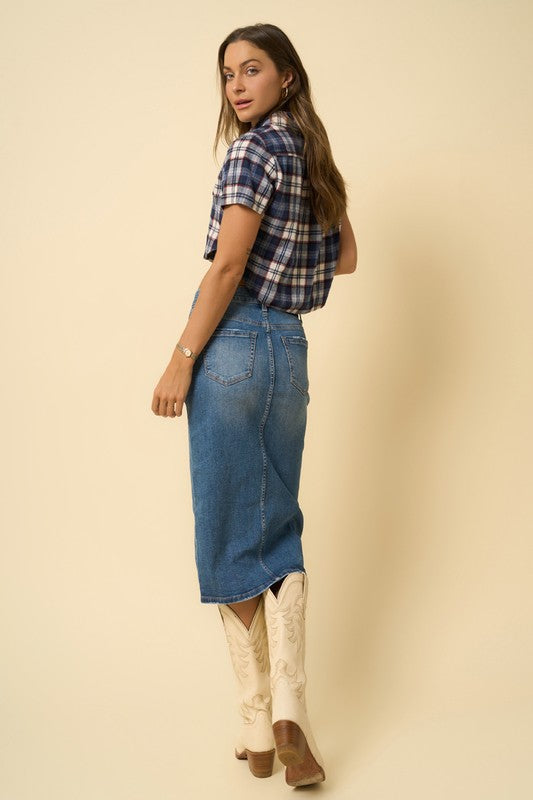 Medium-wash denim midi skirt with slit and belt loops