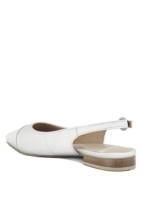 White slingback flats with tan sole, adjustable pin-buckle strap and pointed toe