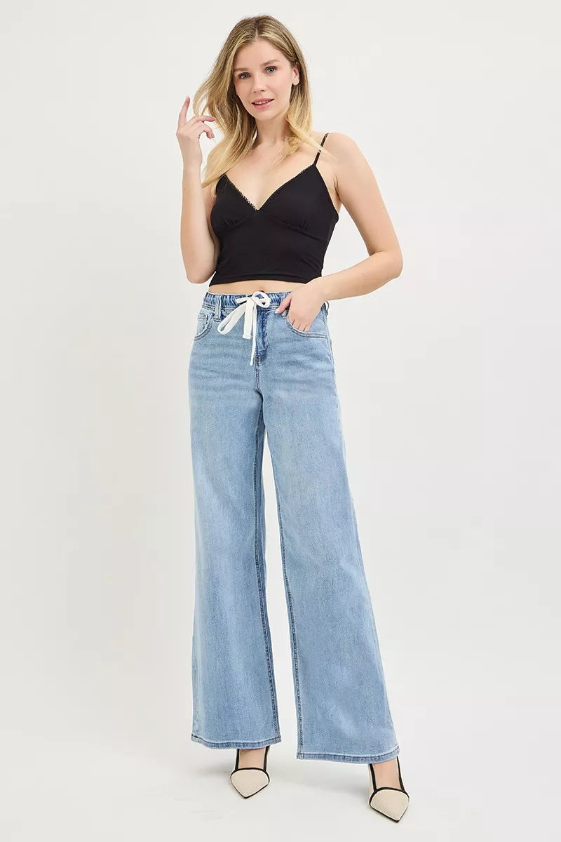 Light-wash wide-leg jeans with elastic waist and white drawstring tie