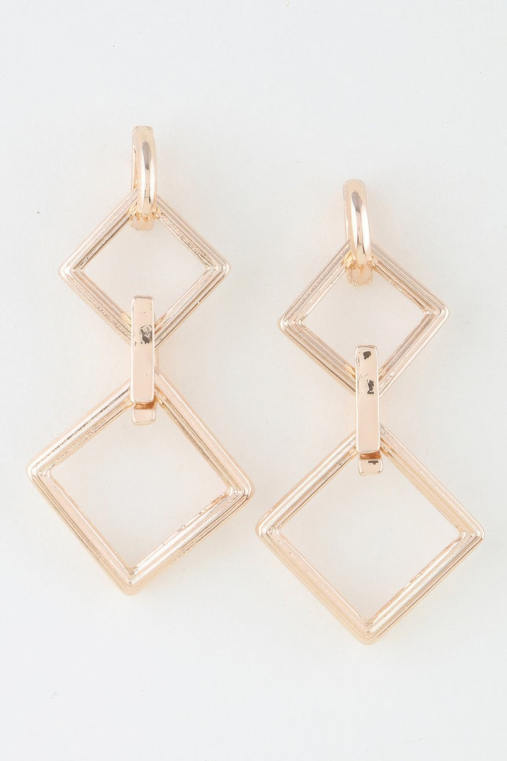 Diamond chain drop earrings with interlocking diamond shapes, gold-tone finish
