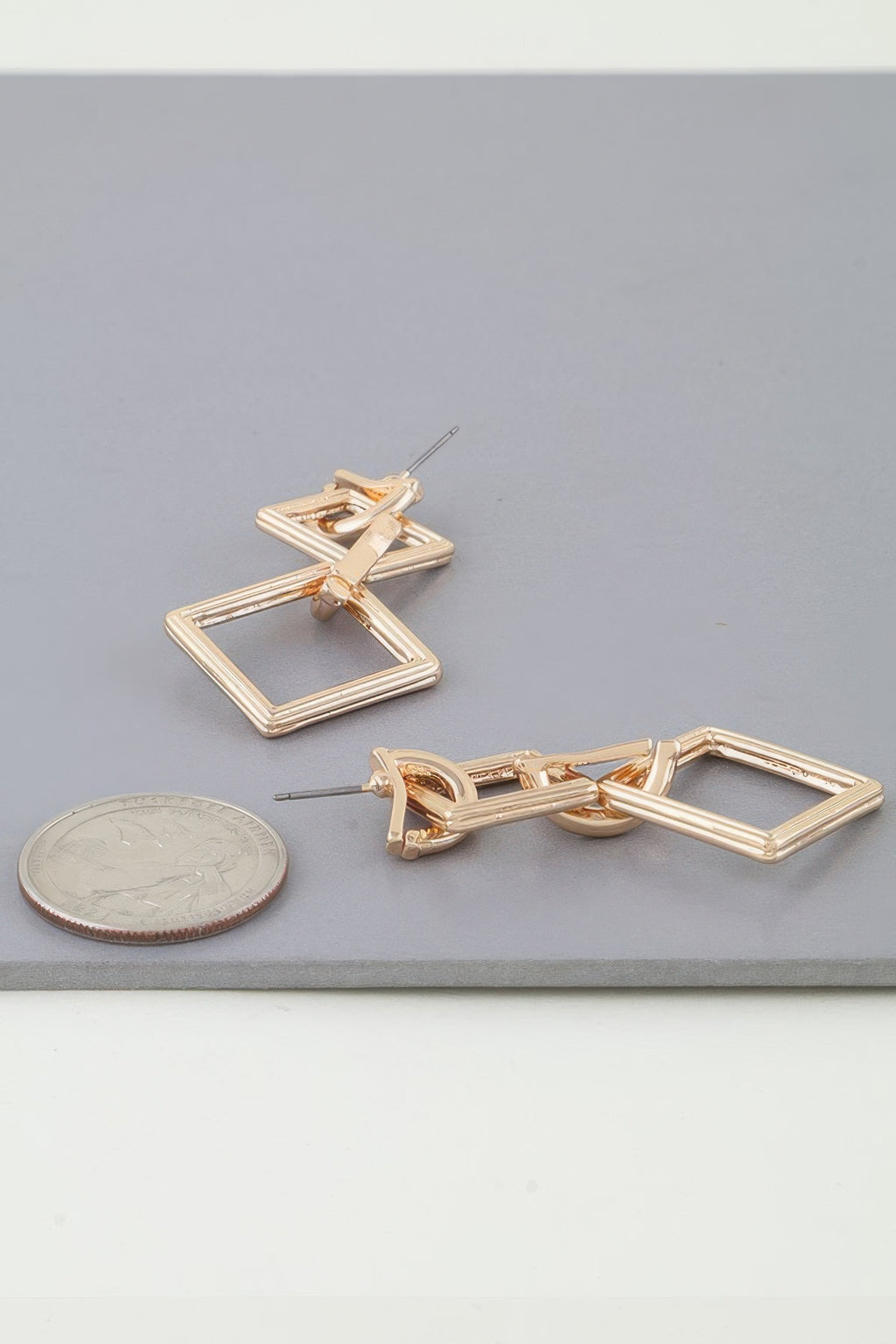 Gold-tone diamond chain drop earrings; stud back with two linked diamond frames