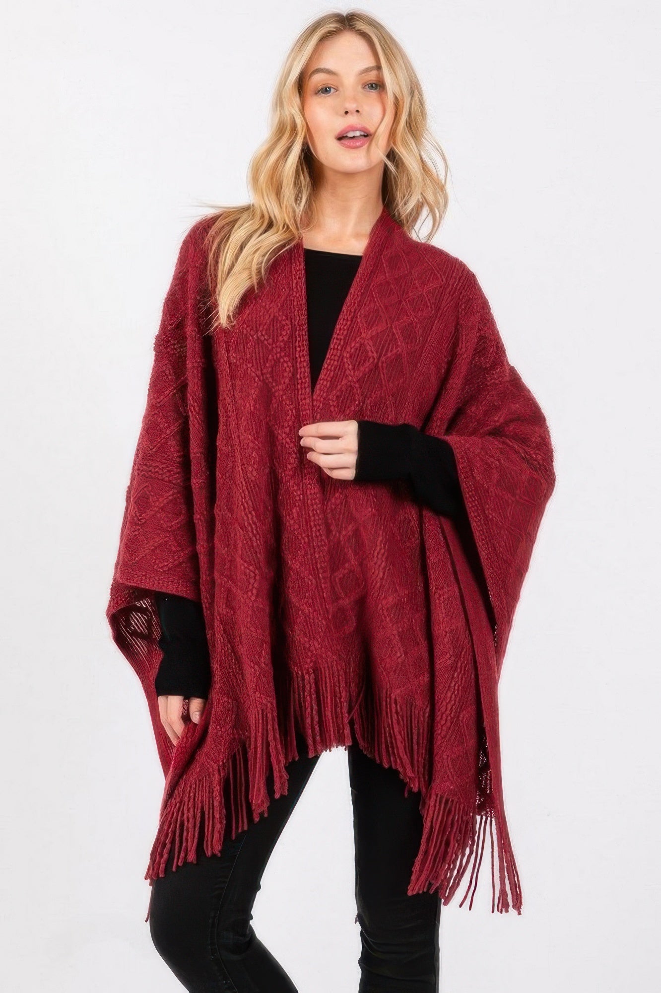 Burgundy diamond knit ruana with long fringe tassels, draped open poncho