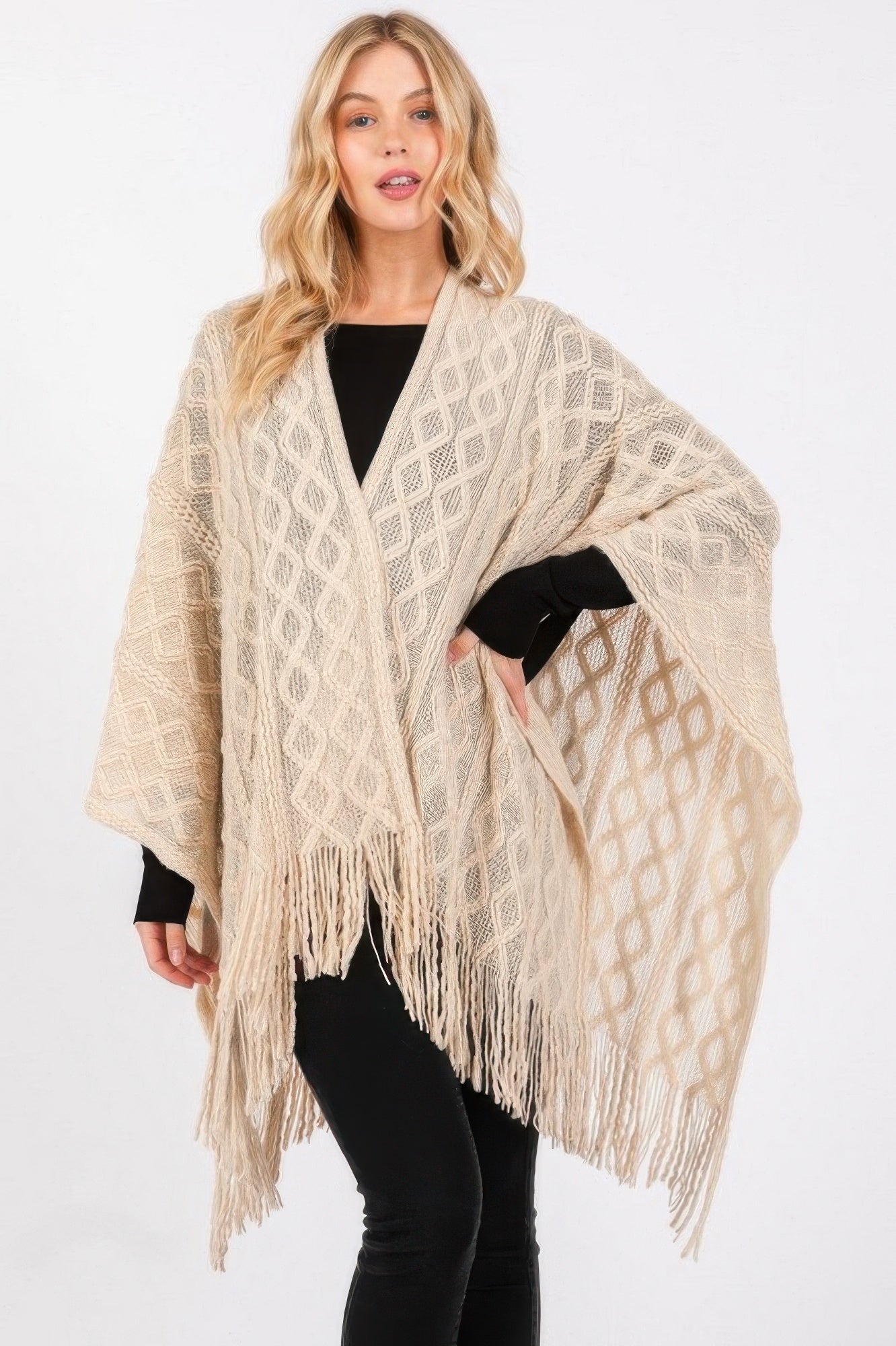 Ivory diamond-knit ruana with long fringe tassels, wide draped shawl