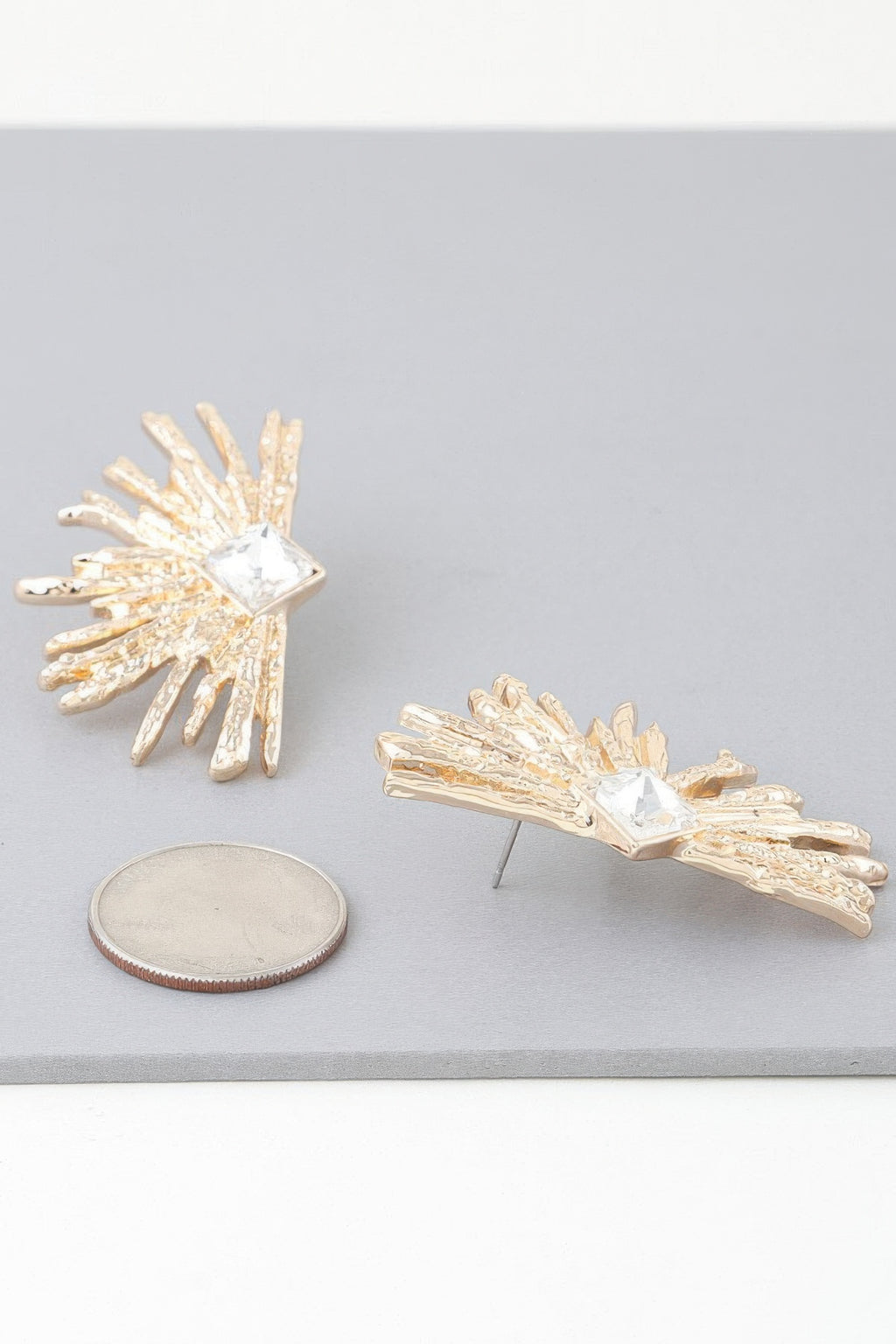 Gold-tone rhinestone flare earrings with square clear crystal and spiked fan design