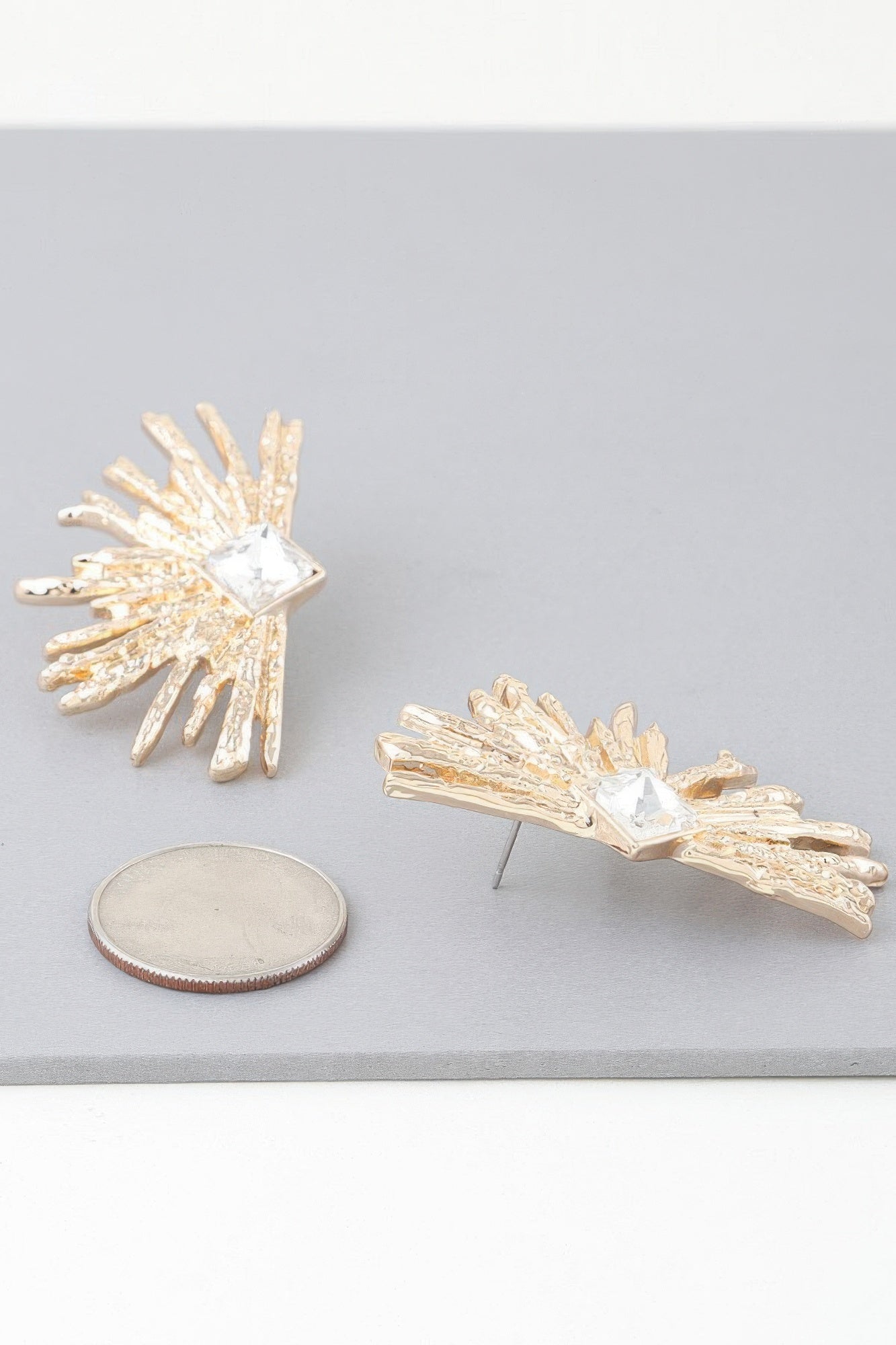 Gold-tone rhinestone flare earrings with square clear crystal and spiked fan design