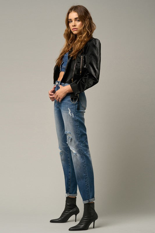 Light blue distressed girlfriend jeans with knee rips, belt loops, and button closure.