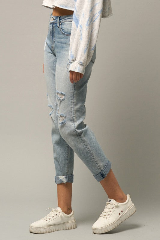 Distressed cropped girlfriend jeans, light blue wash, knee rips and cuffed hem