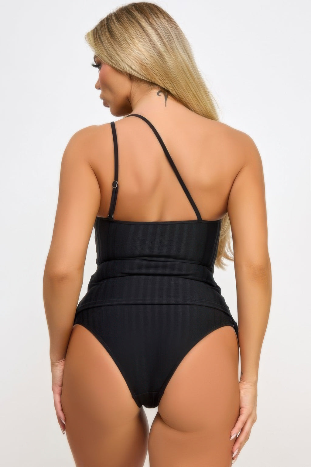 Back view: black tankini with cross-back straps and ruched high-cut bottoms