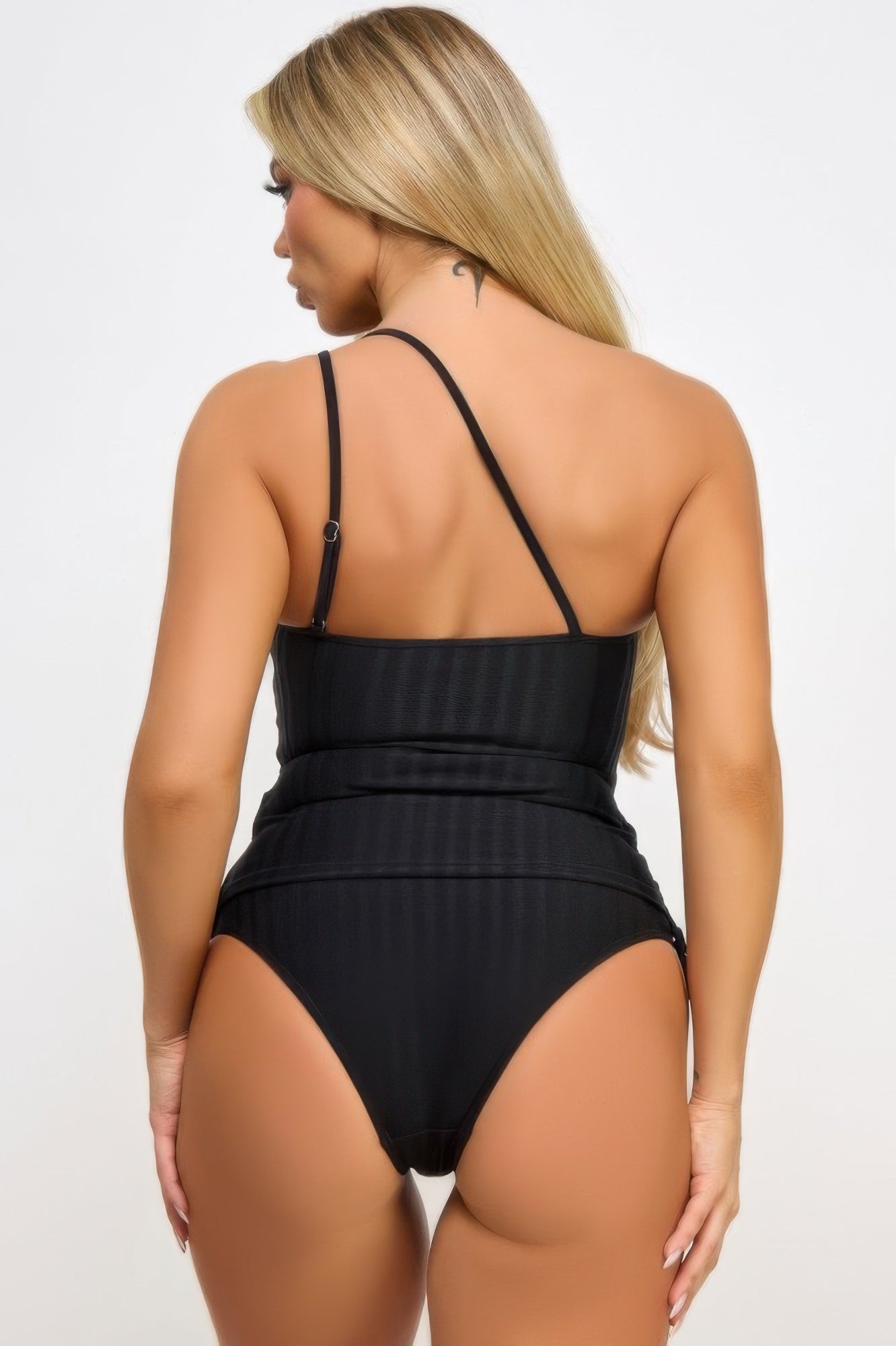 Back view: black tankini with cross-back straps and ruched high-cut bottoms