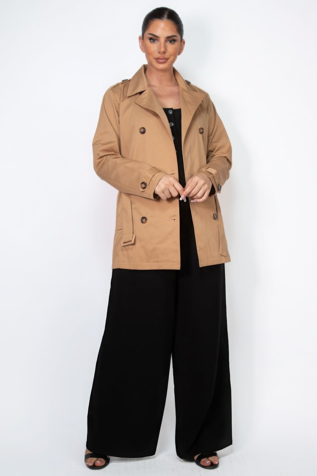 Camel double-breasted belted coat with notch collar, buttons, and front pockets
