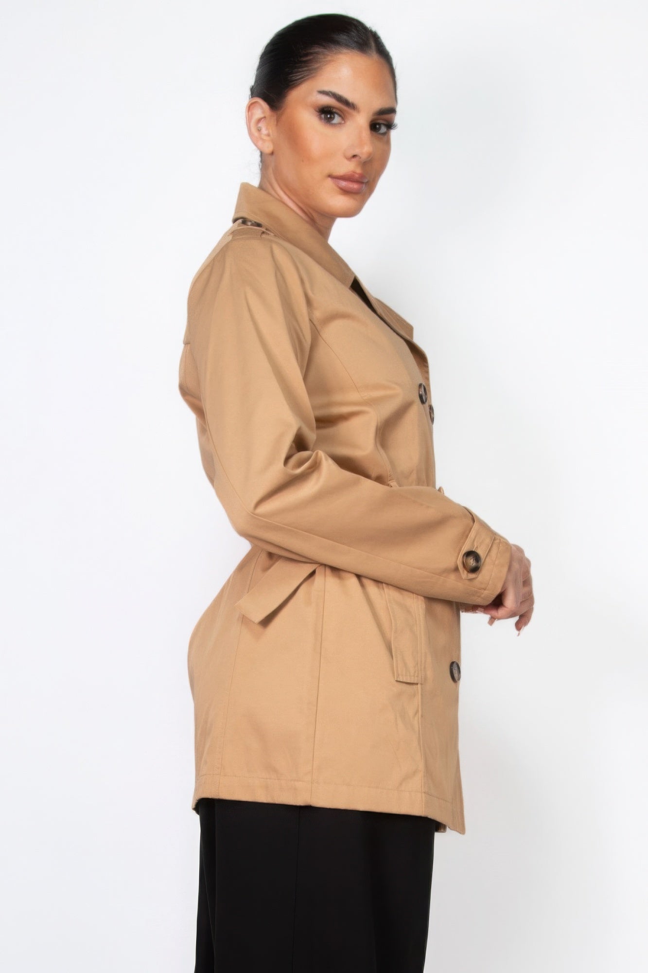 Camel belted double-breasted coat, side view with button detail at cuffs