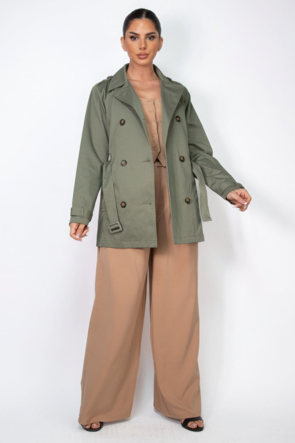 Dark olive double-breasted belted coat front view with notch lapels and buttons