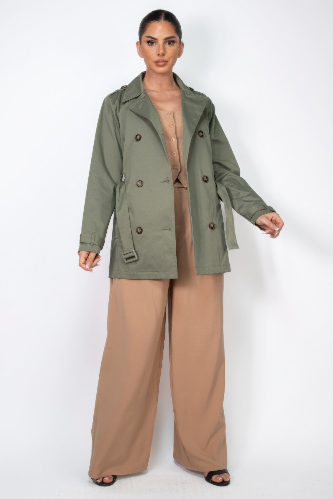 Dark olive double-breasted belted coat front view with notch lapels and buttons