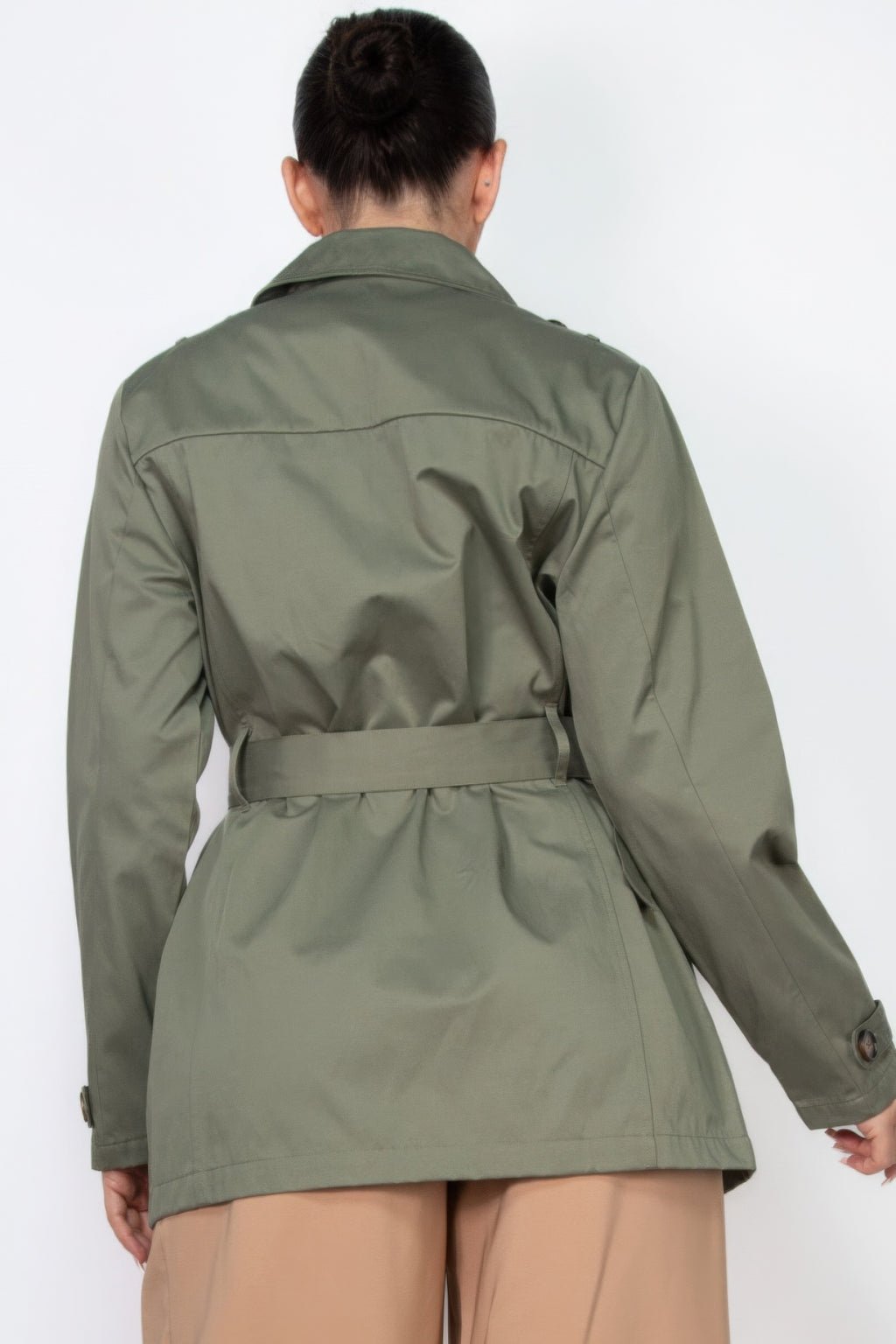 Dark olive belted double-breasted coat back view with shoulder seams and belt