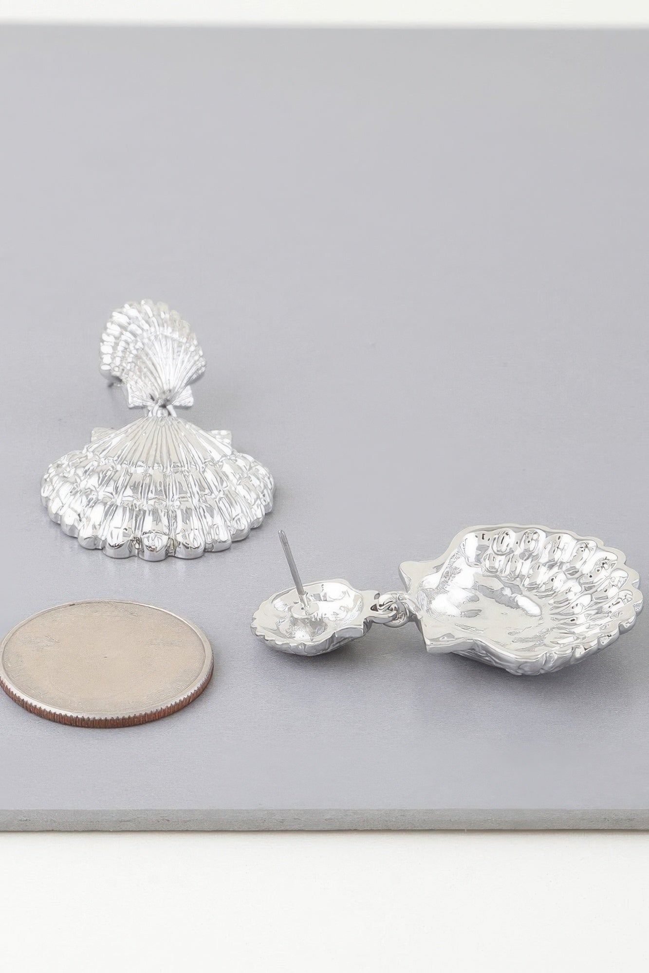 Double clamshell drop earrings in silver-tone, scalloped shell tiers and earring backs