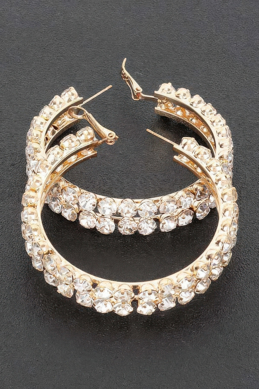 Gold double-row hoop earrings, bright rhinestones lining the outer and inner arcs