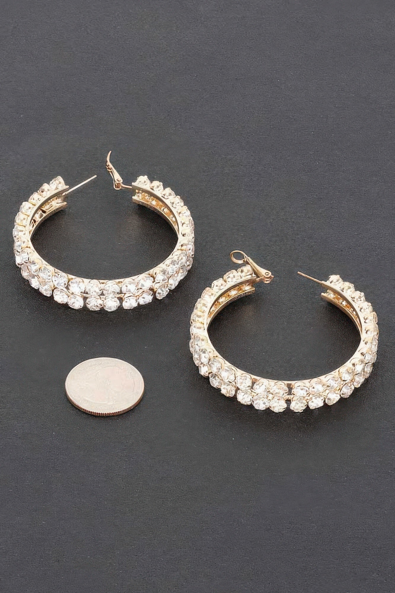 Silver and gold double-layer rhinestone hoop earrings, shown with size coin