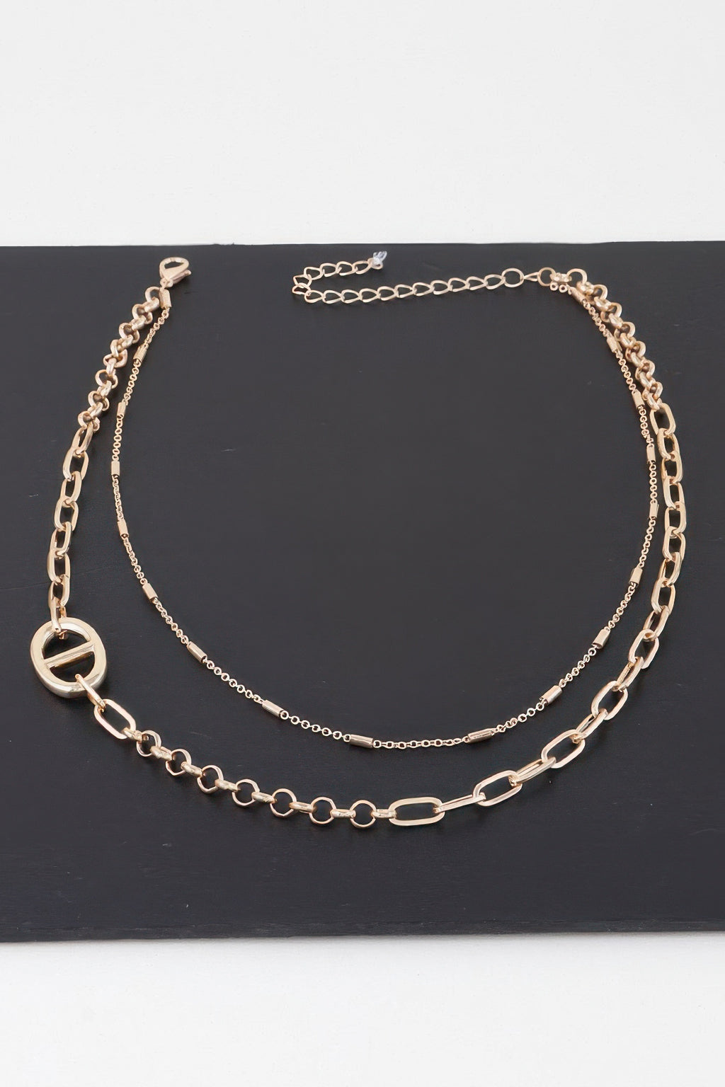 Gold double chain choker with oval and round charm detail
