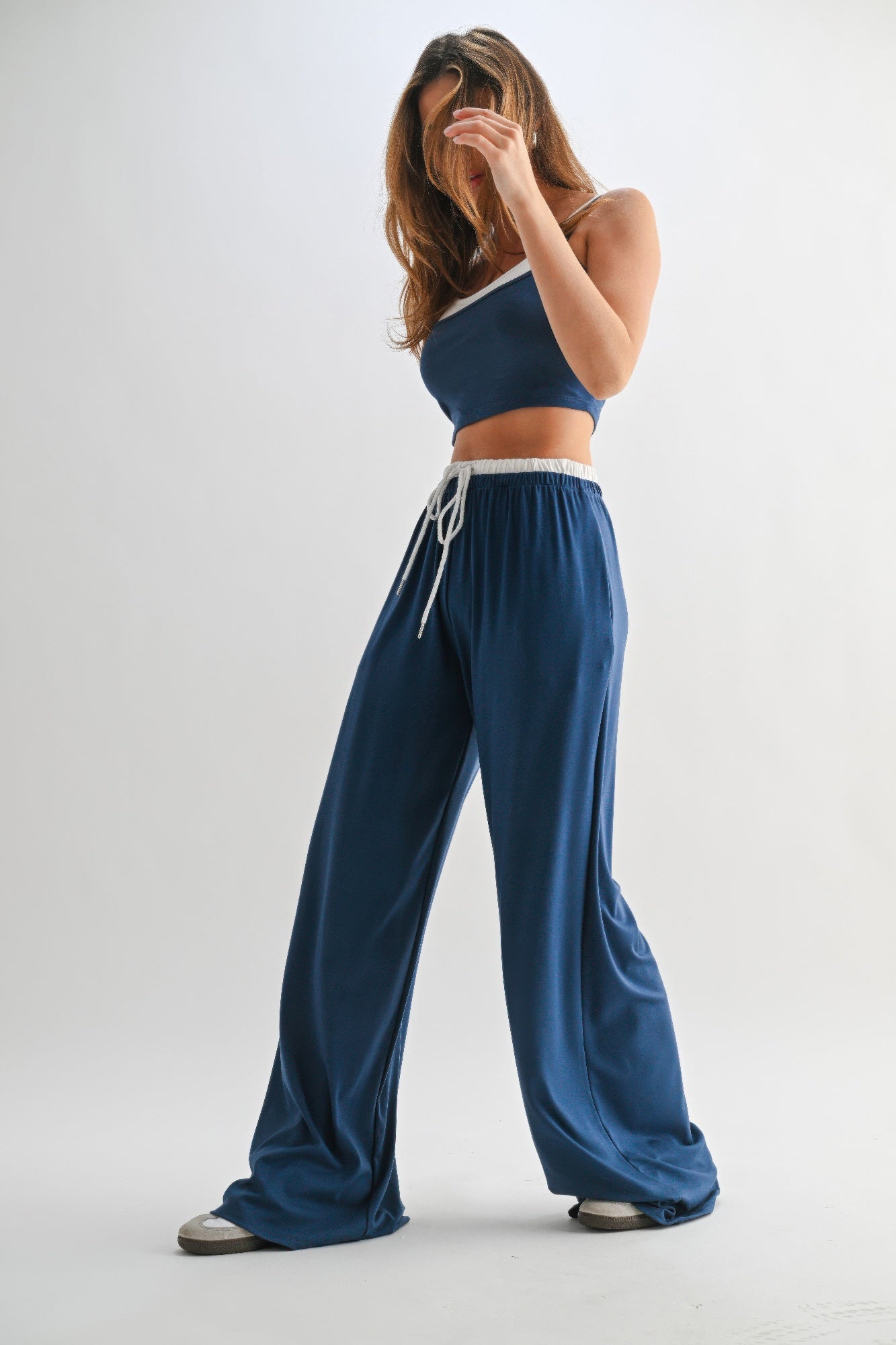 Blue lounge set from the side: crop top with white neckline and drawstring wide pants