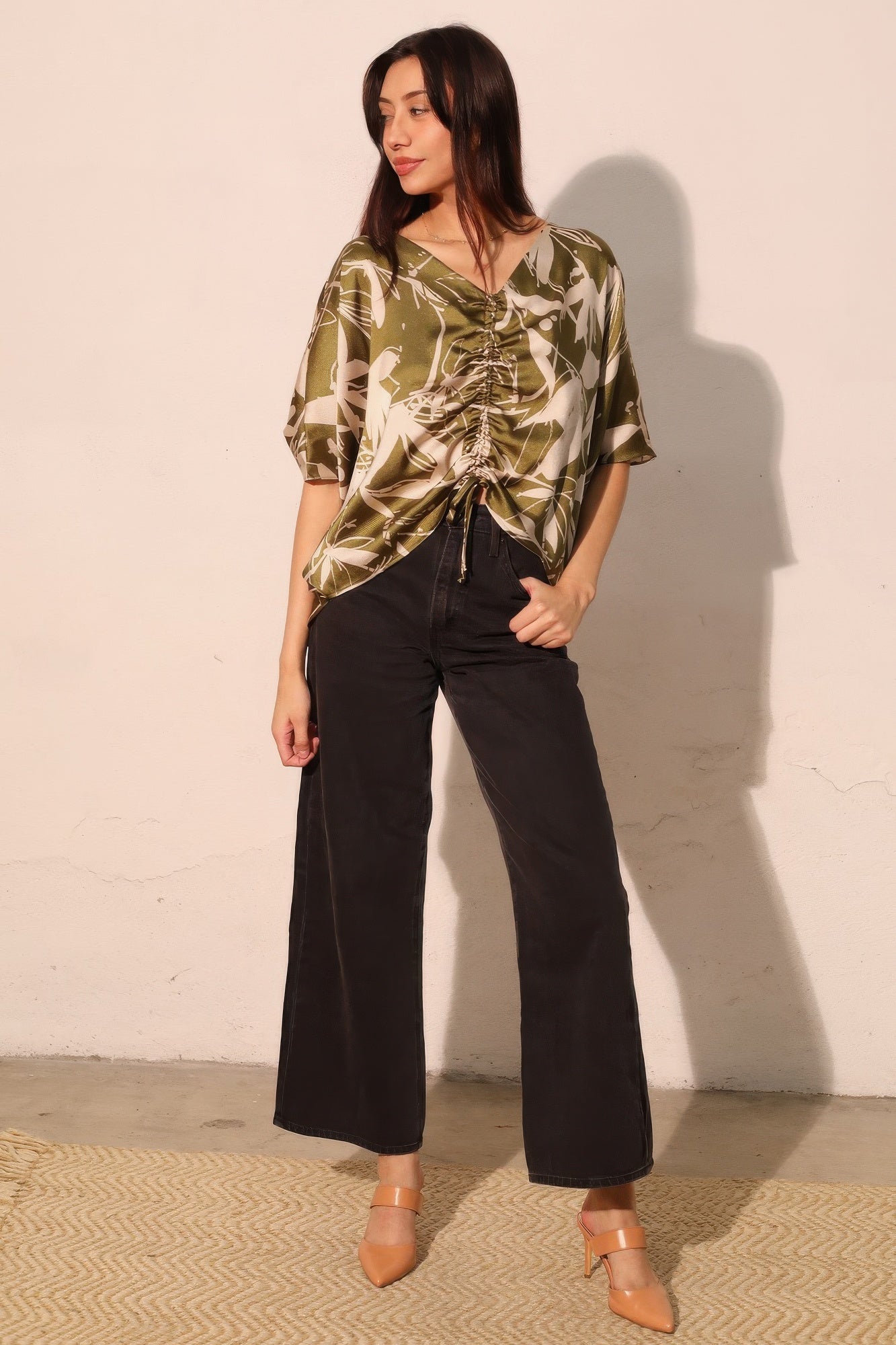 Olive satin dolman drawstring top with V-neck and center ruched tie detail.