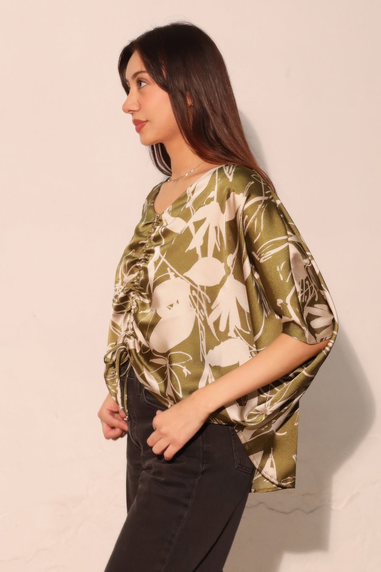 Olive satin dolman blouse with V-neck and tied ruching at the front, floral print.