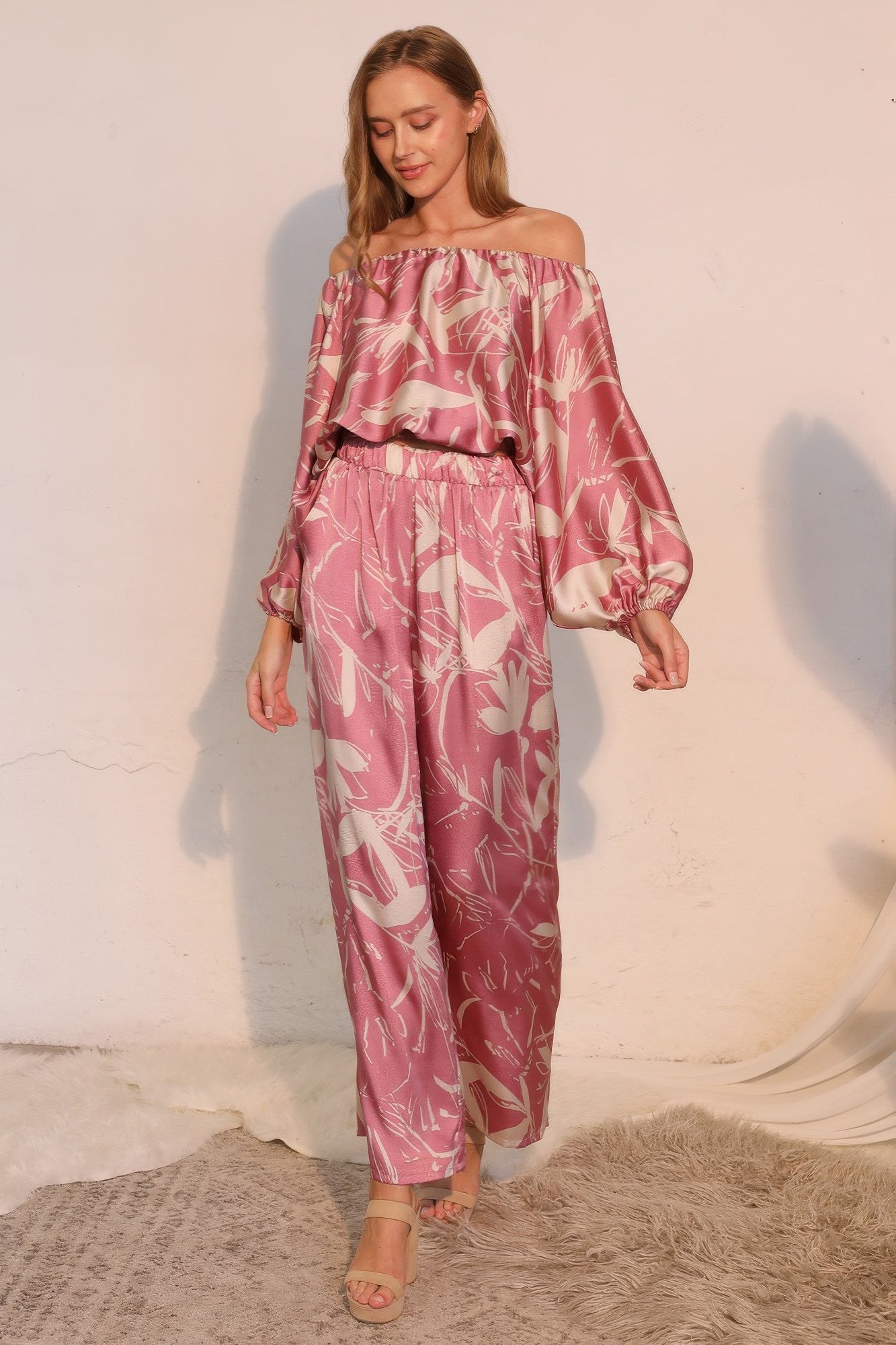 Pink satin pants with allover botanical print, elastic waist, flowy wide-leg fit