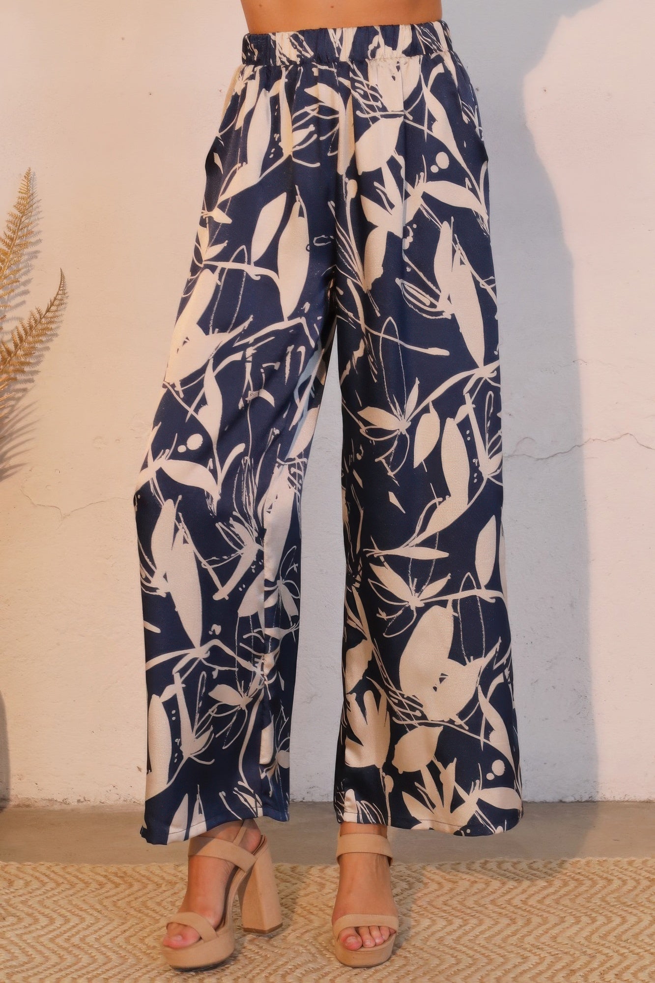 Tigbul's satin pants in navy with cream botanical print, elastic waist, wide-leg