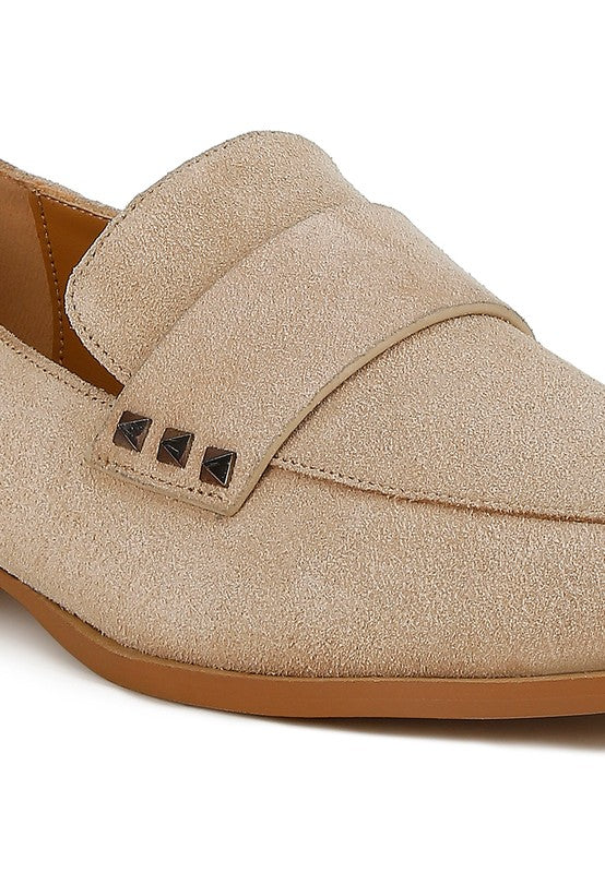 Sand suede loafer with black square studs along the strap