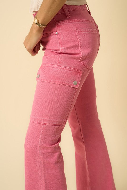 Dusty Pink cargo bootcut jeans close-up: utility pocket tabs and stitched seams