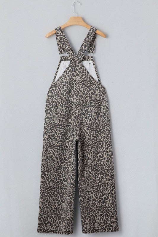 Brown leopard denim overall jumpsuit on hanger with adjustable chest straps