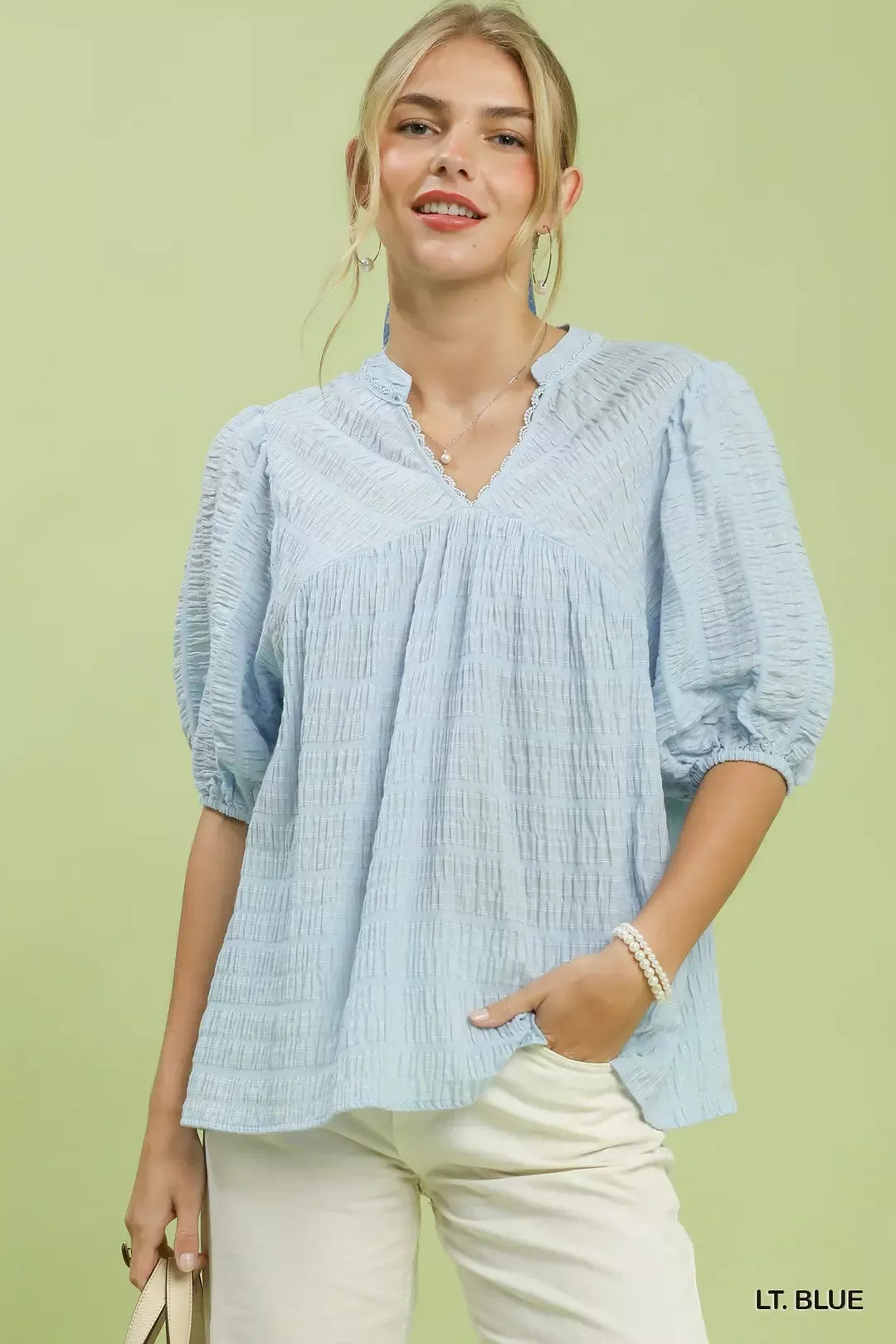 LT. BLUE textured blouse with V-neck and puff sleeves