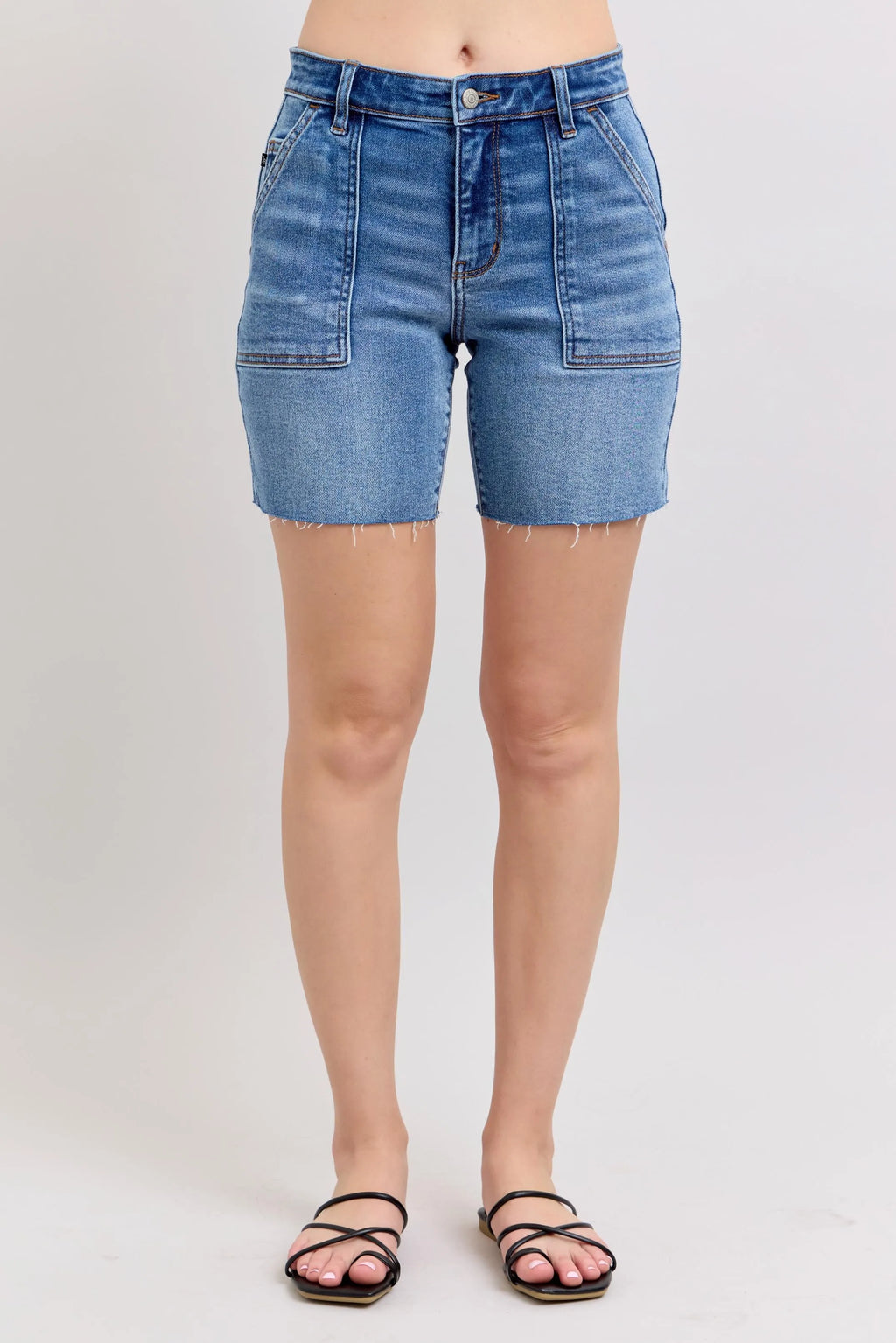 Plus-size mid-rise denim bermuda shorts, light blue wash, front button closure, flap pockets