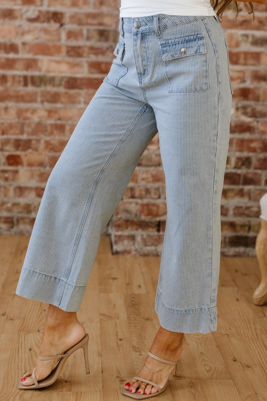Sky blue striped wide-leg jeans with front patch pockets and straight waistband seam