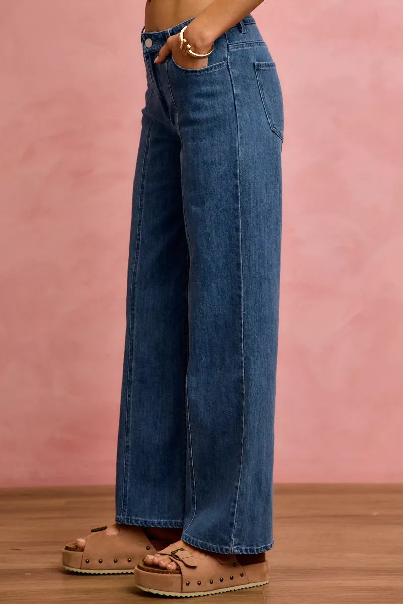 SO ME mid-rise denim jeans showing side view, wide-leg fit and long vertical seam.