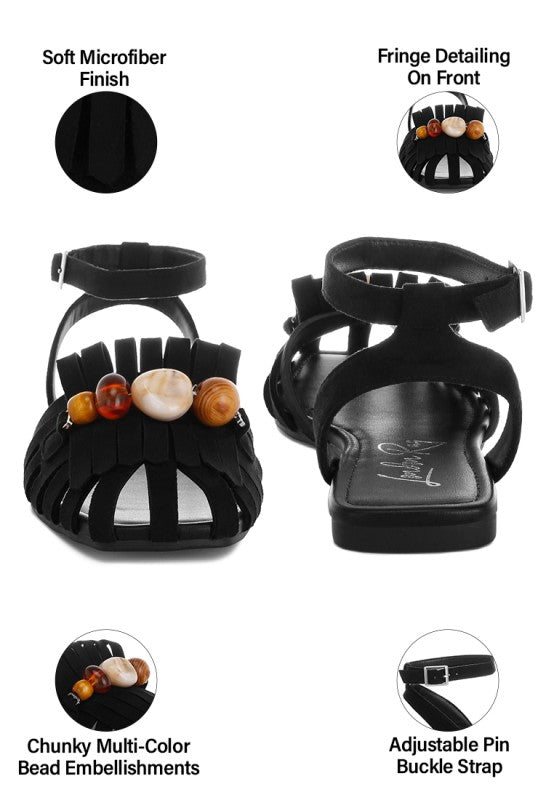 Black cutwork flat sandals—soft microfiber finish, front fringe, adjustable buckle strap