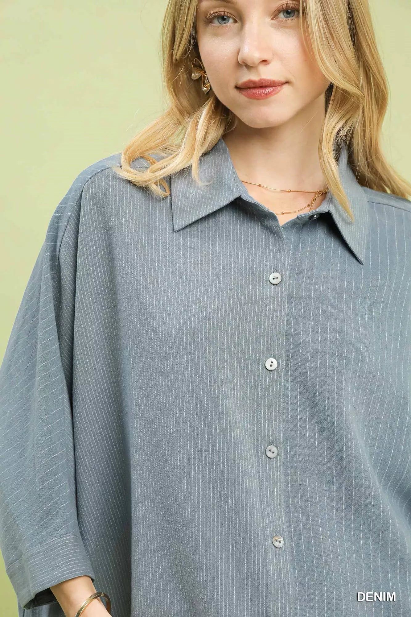 Denim striped button-down shirt detail: point collar and button placket
