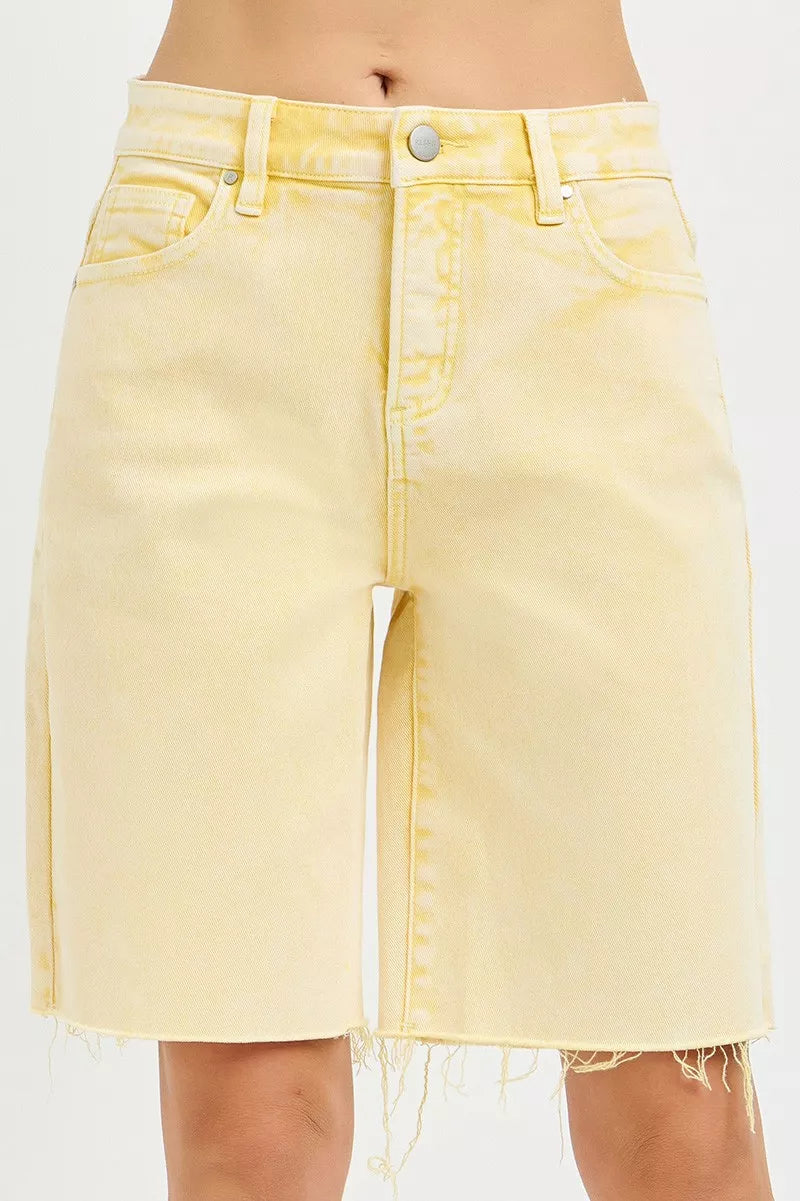 Banana yellow slouchy bermuda shorts with button fly and frayed hem