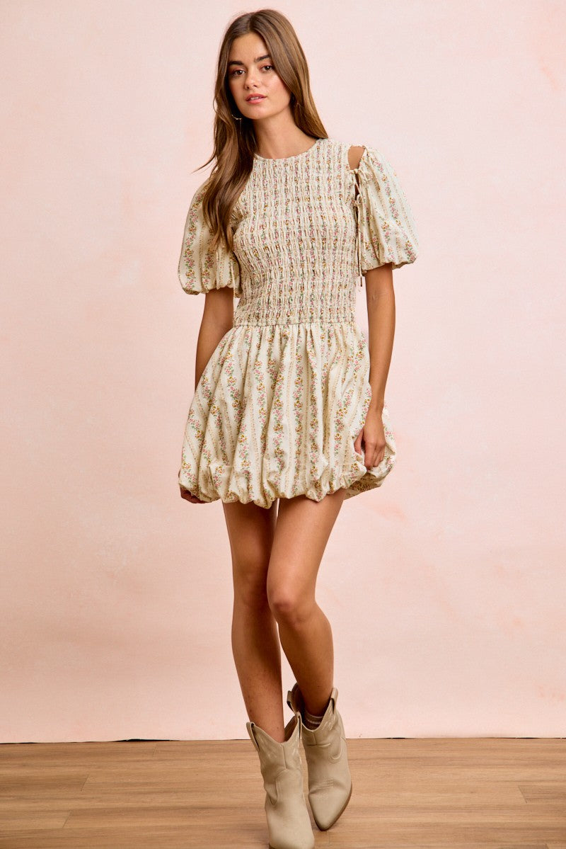 Ivory floral bow-tie puff sleeve dress with smocked bodice and ruffled skirt
