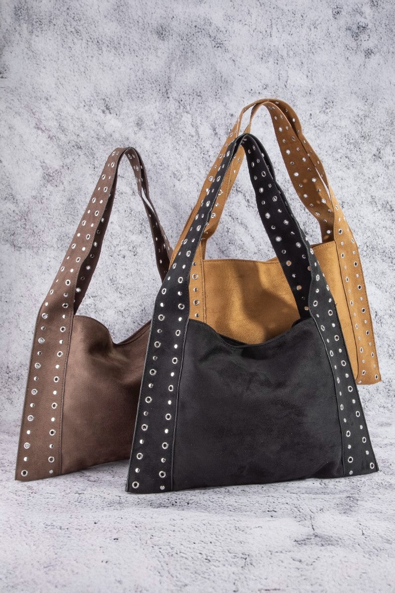 Suede grommet strap shoulder bag in dark brown and black with silver eyelet trim