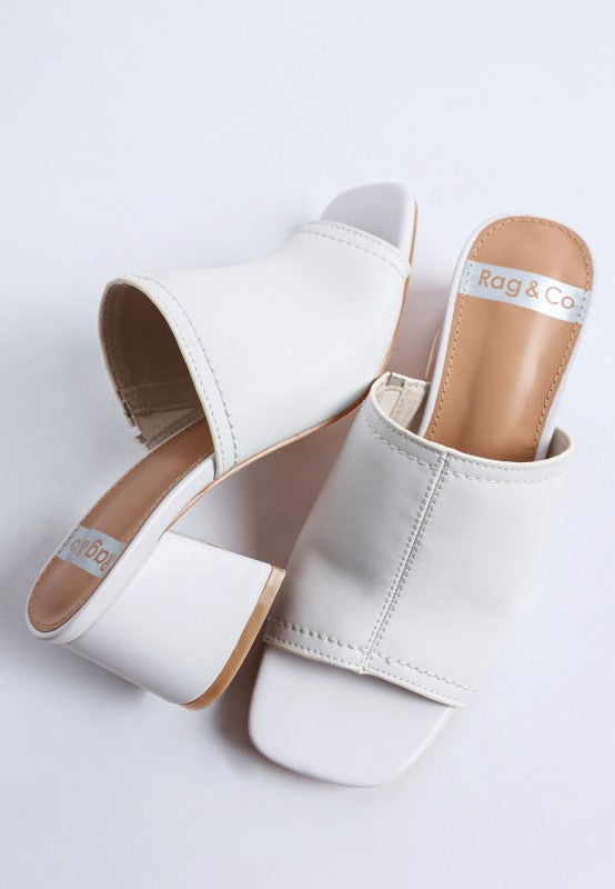White soft leather heeled mules, open squared toe and cushioned insole