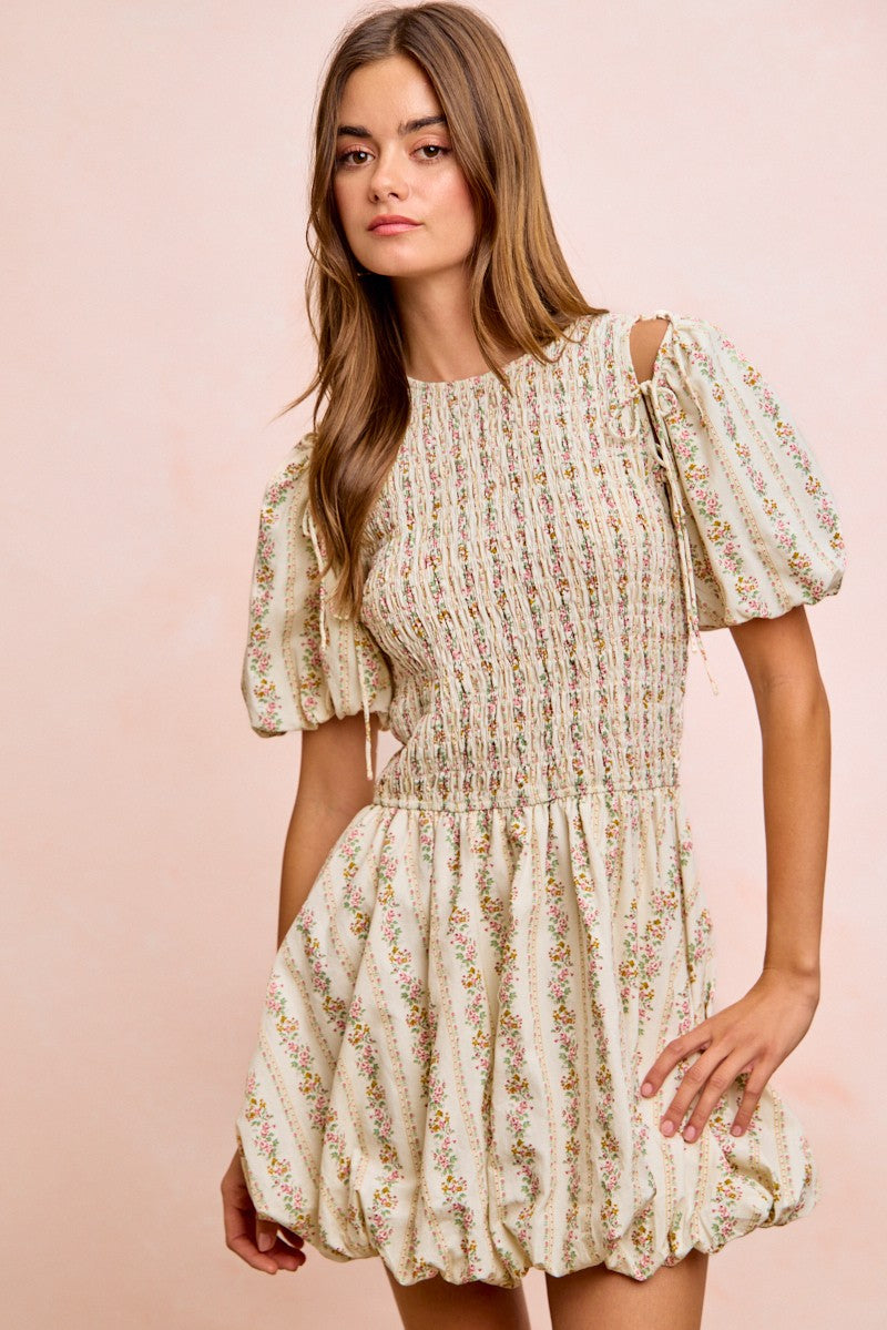Ivory floral smocked bodice dress with puff sleeves and gathered waist