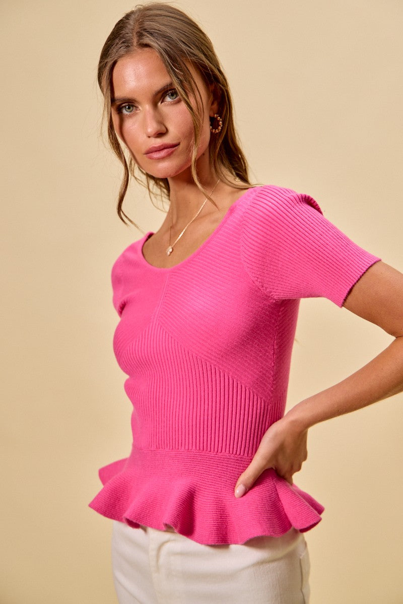 Hot pink ribbed knit peplum sweater top, V-stitch panel and short sleeves