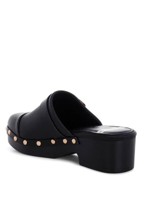 Black mule clog with round toe, studded trim, and wide slip-on opening