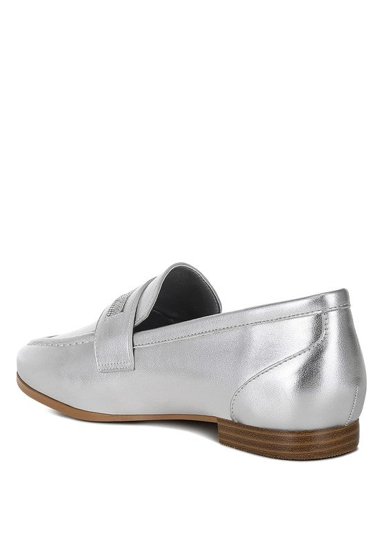Silver metallic loafer rear view with low brown rubber sole