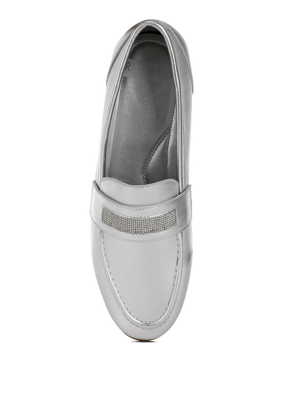 Silver metallic loafer side view showing rhinestone strap texture