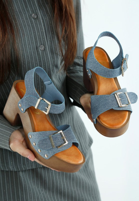 Denim studded clog sandals with dual buckles and open toe, cushioned footbed
