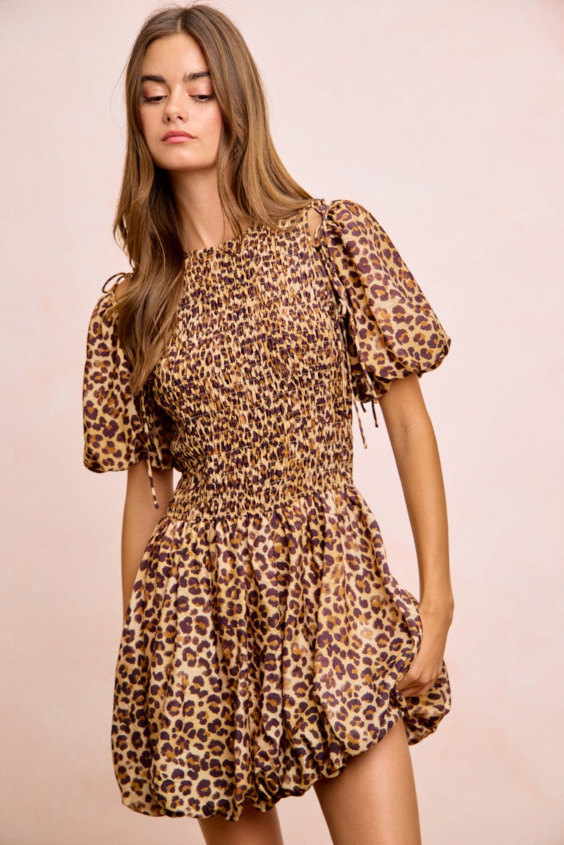 Leopard print mini dress with smocked waist, puff sleeves with tie details