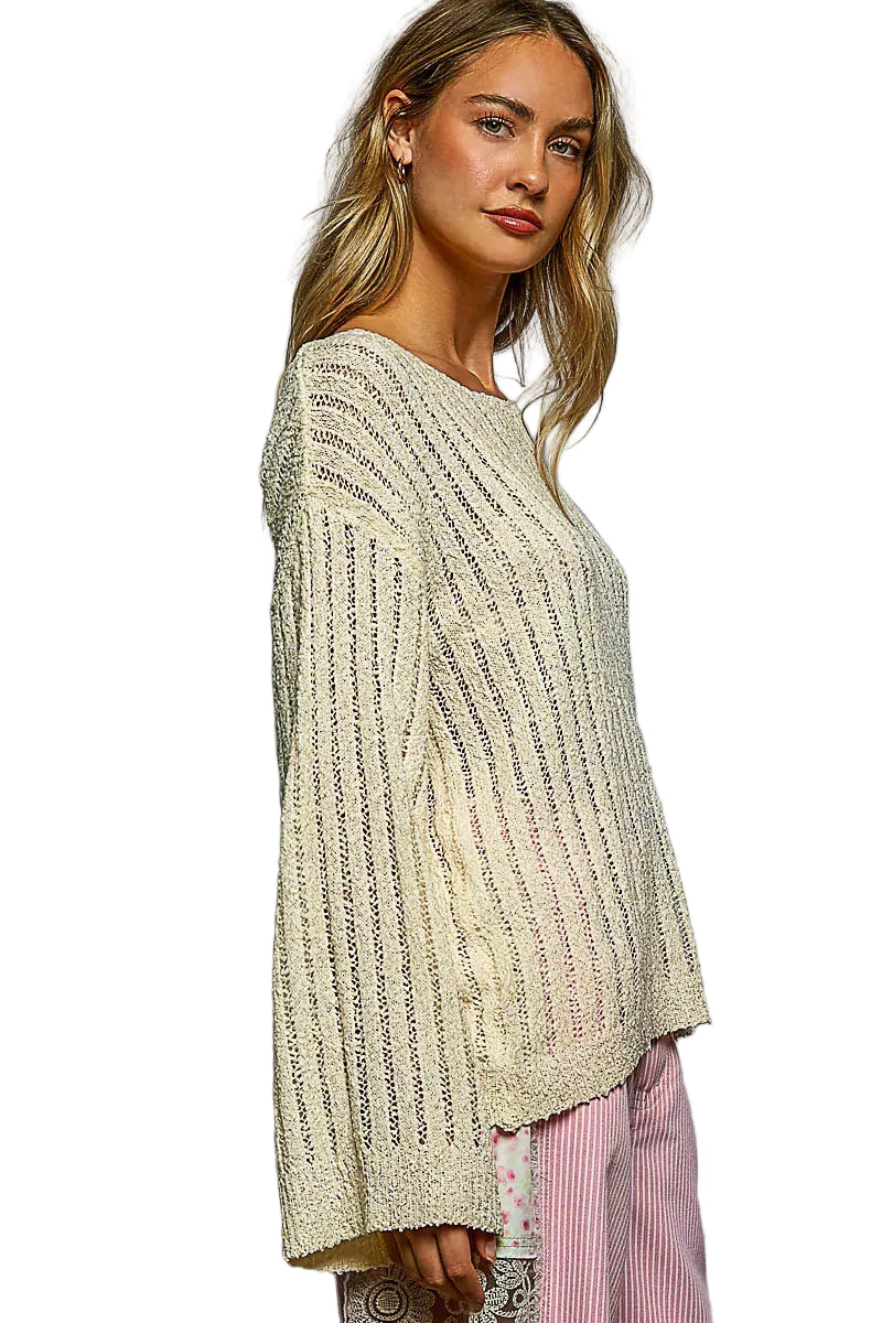 Tan knit sweater with long sleeves and round neck, angled side view