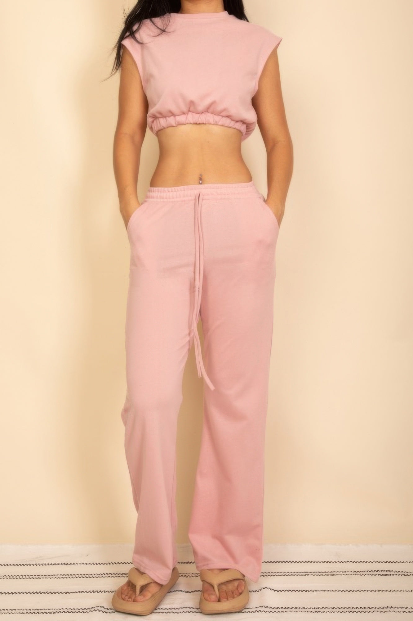 Dusty pink sleeveless crop top and wide-leg pants set with faux drawstring